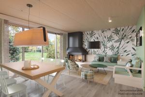 un soggiorno con un tavolo e una sala da pranzo di Center Parcs Villages Nature Paris a Bailly-Romainvilliers