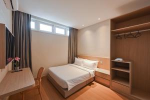 Simple Sanctuary Tanjung Tokong客房内的一张或多张床位