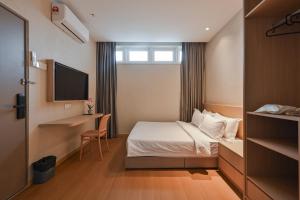 Simple Sanctuary Tanjung Tokong客房内的一张或多张床位