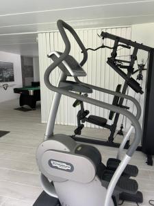 a gym with a exercise bike in a room at O'Calm - Gite A-2h wellness par nuitée à réserver in Jenneville