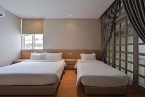 Simple Sanctuary Tanjung Tokong客房内的一张或多张床位