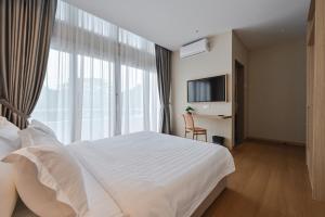 Simple Sanctuary Tanjung Tokong客房内的一张或多张床位