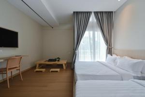 Simple Sanctuary Tanjung Tokong客房内的一张或多张床位