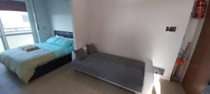 Postel nebo postele na pokoji v ubytování Gaelle Voghera apartment
