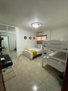 Postel nebo postele na pokoji v ubytování CASA PACHITA Getsemani