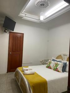 Postel nebo postele na pokoji v ubytování CASA PACHITA Getsemani