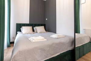 Posteľ alebo postele v izbe v ubytovaní WrocApartments WestCenter - Legnicka Residence