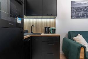 Kuchyňa alebo kuchynka v ubytovaní WrocApartments WestCenter - Legnicka Residence