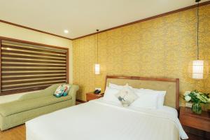 Ένα ή περισσότερα κρεβάτια σε δωμάτιο στο Sunset Westlake Hanoi Hotel