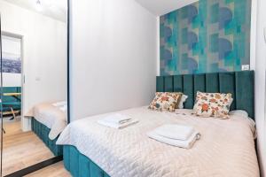 Posteľ alebo postele v izbe v ubytovaní WrocApartments WestCenter - Legnicka Residence