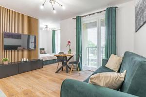 Televízia a/alebo spoločenská miestnosť v ubytovaní WrocApartments WestCenter - Legnicka Residence