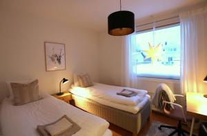 En eller flere senge i et værelse på Stella Borealis