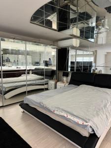 En eller flere senge i et værelse på Tribeca Suit