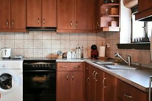 a kitchen with a sink and a dishwasher at Stonehouse - The Secret Place in Vyzitsa