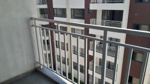 a balcony of an apartment building with windows at Bela Getaway Homes Elegant One bedroom Apartment in Nairobi