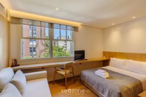 TV a/nebo společenská místnost v ubytování Lindas Unidades no Bairro Auxiliadora em PoA - CEN