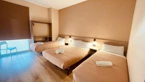 Postel nebo postele na pokoji v ubytování OPTIMUS COMFORT Campoamor 101