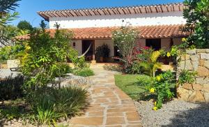 a garden in front of a house at Casa Alamanda B&B in Barichara