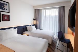Postel nebo postele na pokoji v ubytování Hampton By Hilton Tallinn