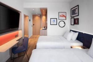 Postel nebo postele na pokoji v ubytování Hampton By Hilton Tallinn
