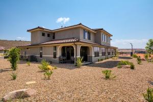a large house with a gravel yard in front of it at Always the Weekend - Pool, Lazy River, Waterslide in Washington