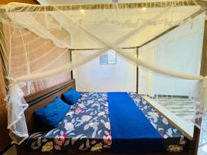 Ένα ή περισσότερα κρεβάτια σε δωμάτιο στο Mangroves homestay +16 φωτογραφίες