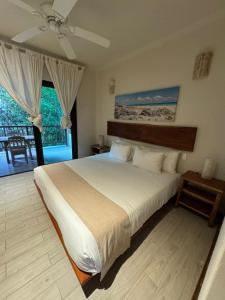 Ένα ή περισσότερα κρεβάτια σε δωμάτιο στο Casa Tulum Hotel