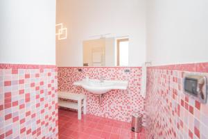 a bathroom with a sink and a mirror at Residenza Sant'Angelo - Art Apartment in Minori +54 photos