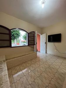 Μια τηλεόραση ή/και κέντρο ψυχαγωγίας στο Excelente casa em Praia Seca