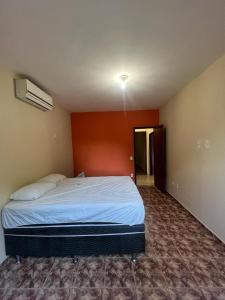 Ένα ή περισσότερα κρεβάτια σε δωμάτιο στο Excelente casa em Praia Seca