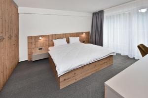 Postel nebo postele na pokoji v ubytování Apartmány Tri sestry Jasná