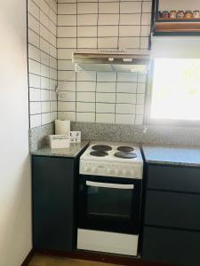 Kuchyň nebo kuchyňský kout v ubytování Los plátanos 1 y 2 + 11 fotografií