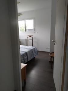 Ένα ή περισσότερα κρεβάτια σε δωμάτιο στο TY SAM Beau T2, terrasse vue mer