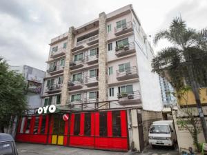 a building with red doors and a building at Haeinsa Condotel in Manila