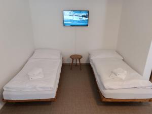 Postel nebo postele na pokoji v ubytování Hotel Bečva na Horní Bečvě