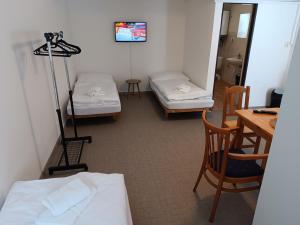 Postel nebo postele na pokoji v ubytování Hotel Bečva na Horní Bečvě