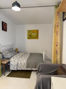 Ένα ή περισσότερα κρεβάτια σε δωμάτιο στο Vaudes chambre