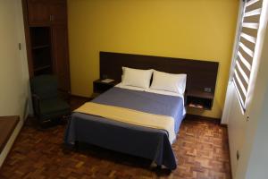 Postel nebo postele na pokoji v ubytování Kunan Hotel