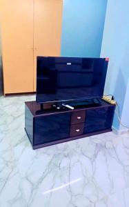 a blue dresser sitting on top of a marble floor at River View Active 02 in Bangkok +8 photos