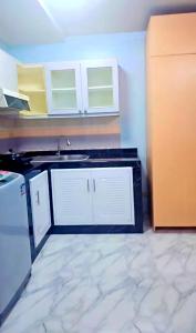 a kitchen with a sink and a counter top at River View Active 02 in Bangkok