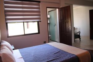 Postel nebo postele na pokoji v ubytování Kunan Hotel