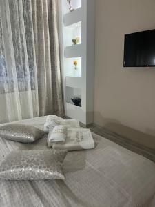 Postel nebo postele na pokoji v ubytování Apartman Trg Lux