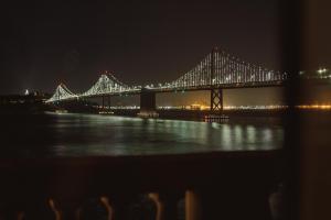 a large bridge lit up at night at Harbor Court Hotel in San Francisco