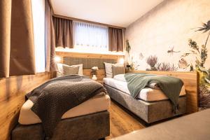 Postel nebo postele na pokoji v ubytování Pension Kumbichlhof