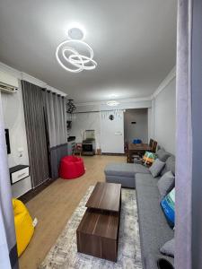 a living room with a couch and a table at Blue Bay Asia El Sokhna Aqua Park in Ain Sokhna