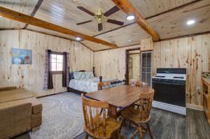 a bedroom with a table and a bed in a room at Winmar Cabins in Twin Lakes