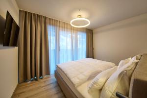 Ένα ή περισσότερα κρεβάτια σε δωμάτιο στο LH Suites Aparthotel NEW OPENING inkl JokerCard