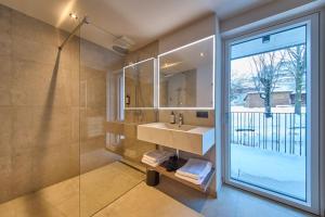 Ένα μπάνιο στο LH Suites Aparthotel NEW OPENING inkl JokerCard