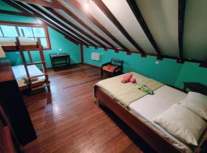 a bedroom with a bed with a teddy bear on it at Vista Drake Lodge in Drake Bay Airport
