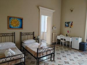 Posteľ alebo postele v izbe v ubytovaní Palazzo Castellano